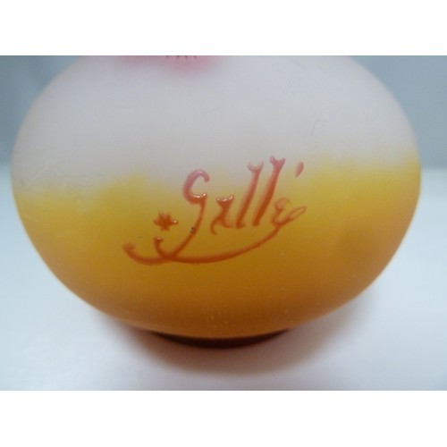 24 - Galle - a cameo glass vase, of onion form, the  cranberry coloured overlay cut through to frosted or... 