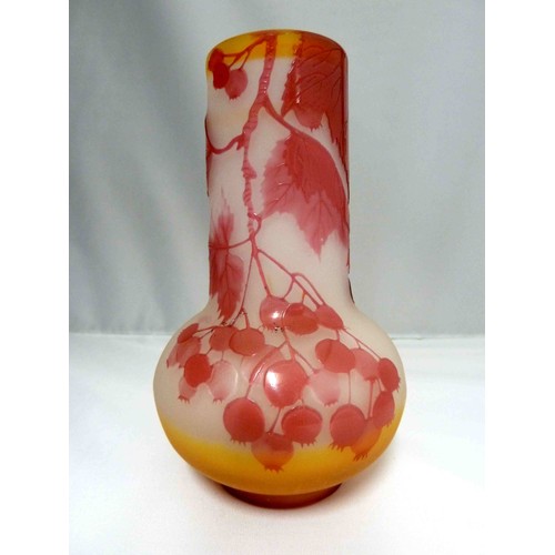 24 - Galle - a cameo glass vase, of onion form, the  cranberry coloured overlay cut through to frosted or... 