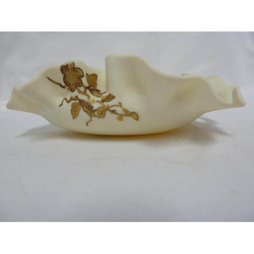 86 - Harrach - a glass leaf form dish, of cream coloured body the rim crimped and with applied trail hand... 