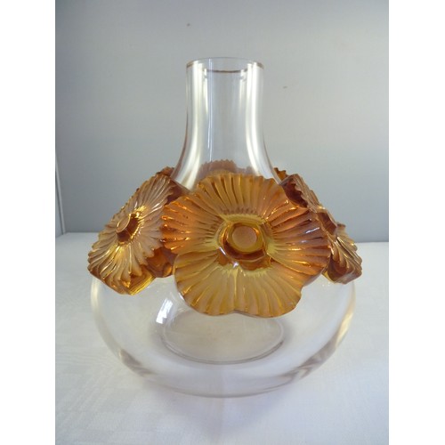 33 - Lalique - a Atossa flower vase, the colourless squat bottle form applied with high relief amber flow... 