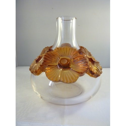 33 - Lalique - a Atossa flower vase, the colourless squat bottle form applied with high relief amber flow... 