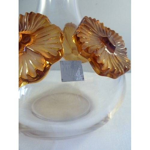 33 - Lalique - a Atossa flower vase, the colourless squat bottle form applied with high relief amber flow... 