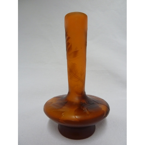 27 - Galle - a cameo glass vase, of flattened bottle form, the brown overlay cut through to orange with a... 