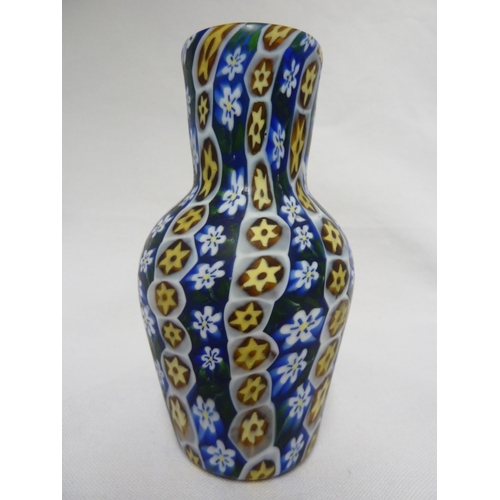 179 - Fratelli Toso - a fused millifiore cane glass vase of blue, white and yellow canes, baluster form,  ... 