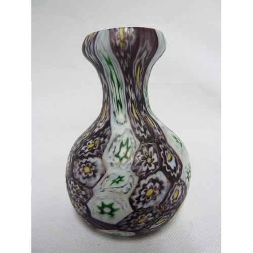 177 - Fratelli Toso - a small fused  millefiori cane glass vase, of onion form, the canes of deep purple, ... 