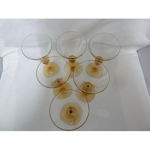 132 - Keith Murray for Stevens and Williams - six wine glasses, the colourless conical bowl set on an ambe... 