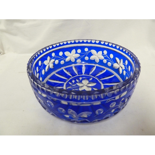 65 - Bohemian Glass - a cobalt blue overlay glass bowl, the blue cut through to colourless with a fruitin... 