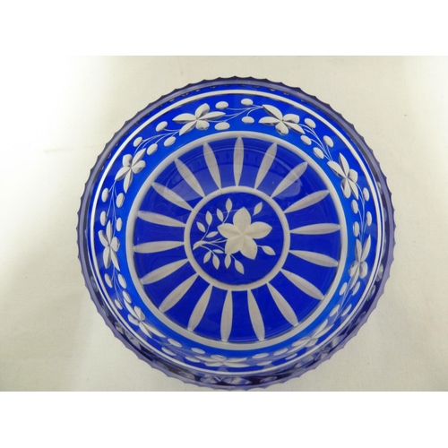 65 - Bohemian Glass - a cobalt blue overlay glass bowl, the blue cut through to colourless with a fruitin... 