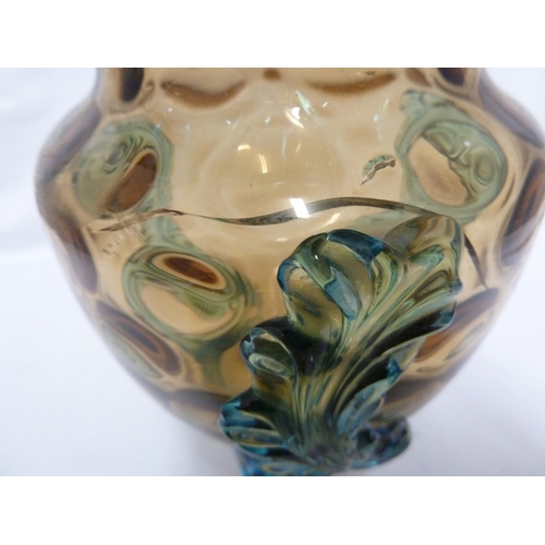 62 - Bohemian Glass - an amber glass vase applied with blue acanthus leaves on three feet; and an amber g... 