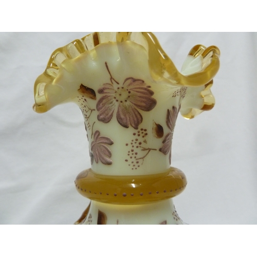 83 - Harrach - a cream glass vase of squat bottle form the frilled rim with amber glass trailing and enam... 