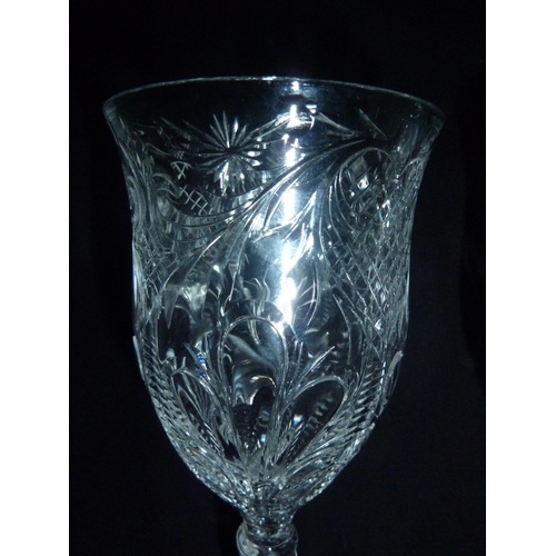 99 - Stevens and Williams - a pair of rock crystal wine glasses, the bowls decorated with four acanthus l... 