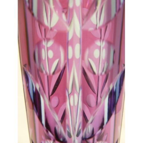 245 - Karel Wunsch - a cut glass cylinder vase, the fuschia overlay cut through to purple/blue with a styl... 