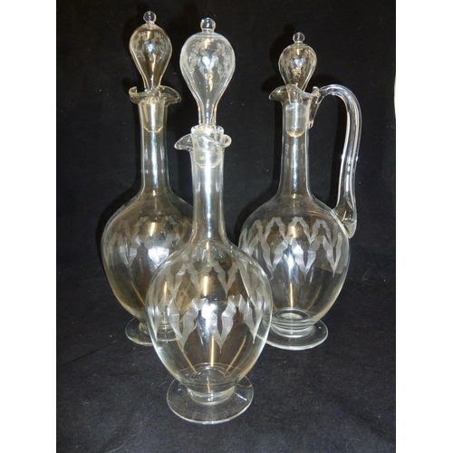 138 - James Powell & Sons, Whitefriars Limited - a wine set, comprising Claret jug with handle; red wine d... 