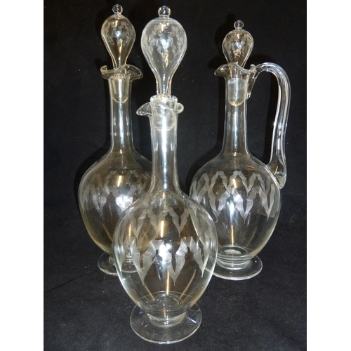 138 - James Powell & Sons, Whitefriars Limited - a wine set, comprising Claret jug with handle; red wine d... 