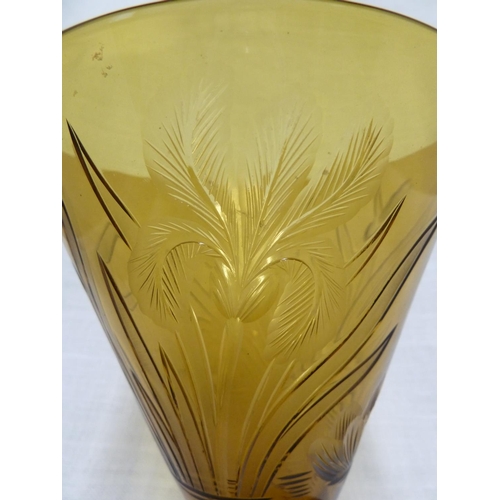 127 - Walsh Walsh - an amber conical glass vase, intaglio cut with Iris flowers, Waterlilies and leaves, 1... 