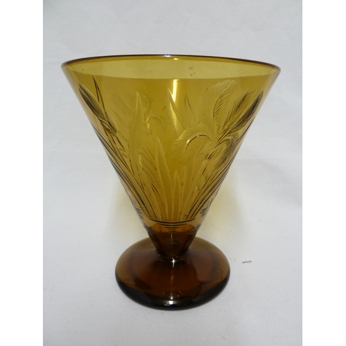 127 - Walsh Walsh - an amber conical glass vase, intaglio cut with Iris flowers, Waterlilies and leaves, 1... 