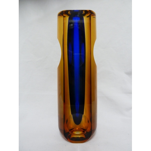 212 - Eduard Soukup - a glass sommerso vase, the amber/blue casing cut with slices and lenses, engraved si... 