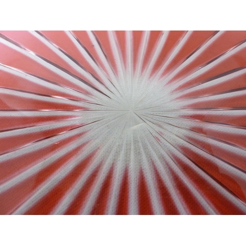 67 - Bohemian - a red flashed glass tray, circular, the base cut with a sunburst within a gallery edge cu... 