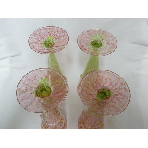 183 - Salviati - four champagne flutes, of conical form on circular bases, the body of rose pink graduatin... 