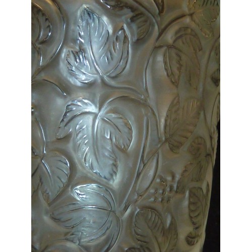 32 - Lalique - a frosted colourless glass vase, the body of tapered cylindrical form on circular pedestal... 