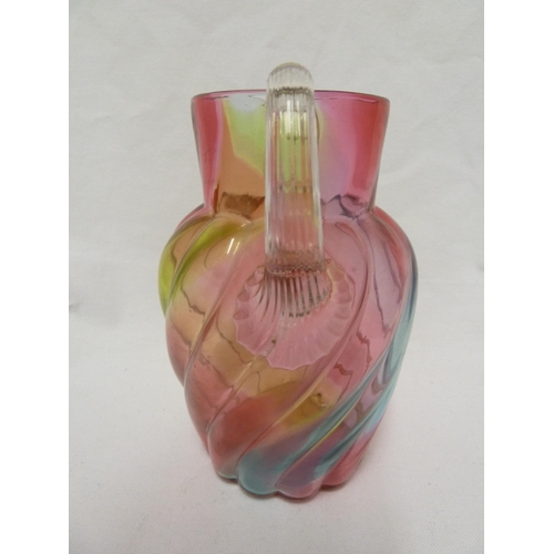 103 - Stevens and Williams - a Rainbow glass jug, of ovoid wrythen moulded body with applied colourless fl... 