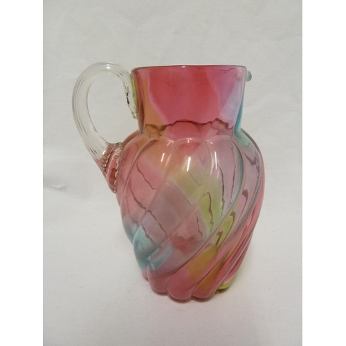 103 - Stevens and Williams - a Rainbow glass jug, of ovoid wrythen moulded body with applied colourless fl... 