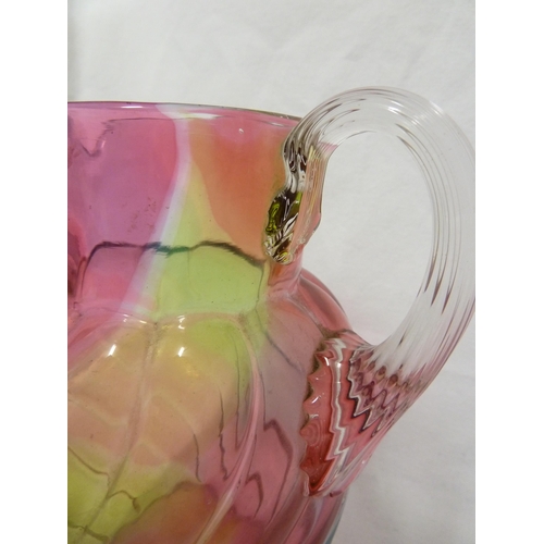 103 - Stevens and Williams - a Rainbow glass jug, of ovoid wrythen moulded body with applied colourless fl... 