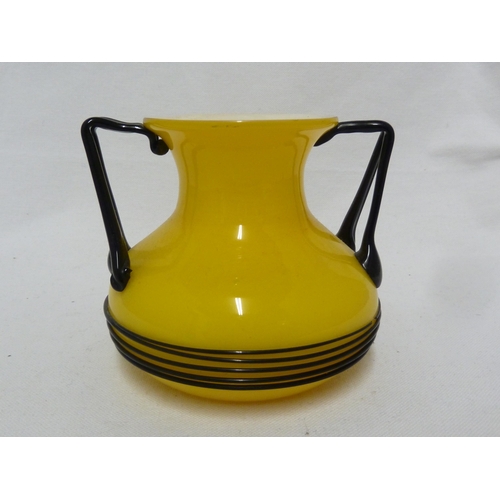 3 - Loetz - a Tango glass urn, of bright yellow over white applied with bifurcated angular glass handles... 