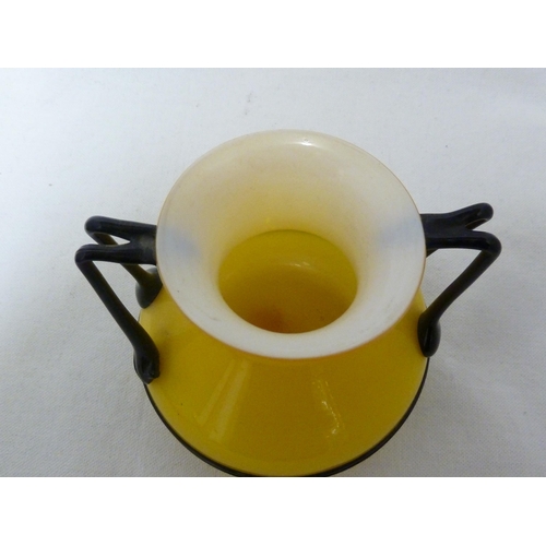 3 - Loetz - a Tango glass urn, of bright yellow over white applied with bifurcated angular glass handles... 