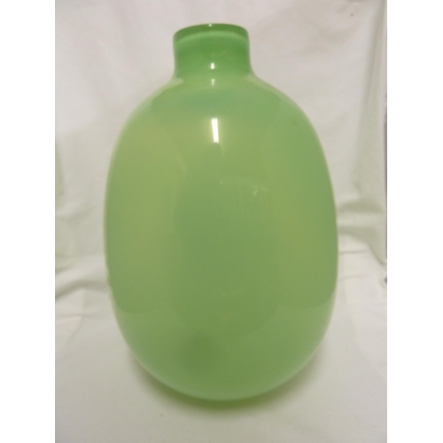 218 - Zbigniew Horbowy for the Krakow Glassworks - a green glass vase of ovoid form with short cylindrical... 