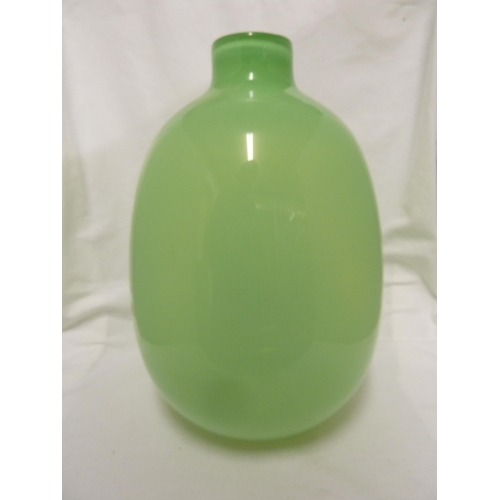 218 - Zbigniew Horbowy for the Krakow Glassworks - a green glass vase of ovoid form with short cylindrical... 