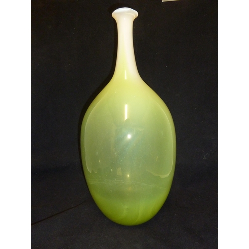 232 - Joseph Hodspodka - an ovoid glass bottle vase, in white graduating to bright green cased glass, part... 