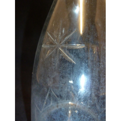 123 - English Glass - a decanter and stopper of mallet form decorated with stars over a triangular banded ... 