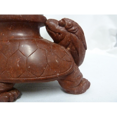 248 - A Chinese hardstone libation cup form sculpture, decorated with dragons fighting for a flaming pearl... 