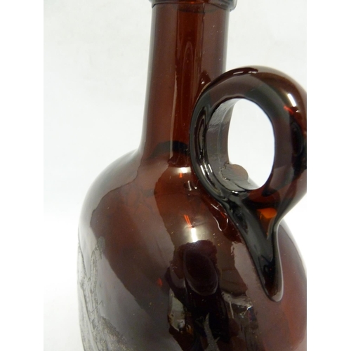 252 - A P Haag, engraver - a 19th Century brown glass finger loop bottle decanter, engraved with a hunting... 