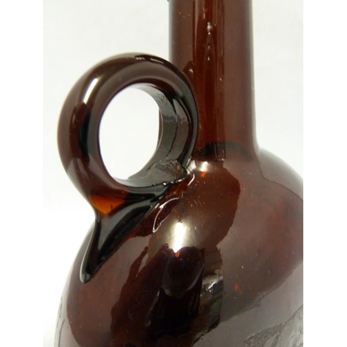 252 - A P Haag, engraver - a 19th Century brown glass finger loop bottle decanter, engraved with a hunting... 