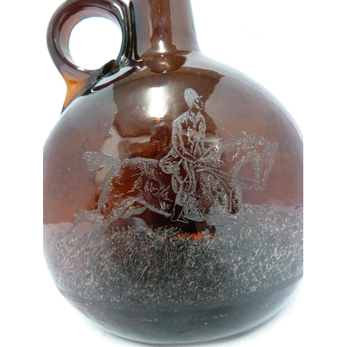 252 - A P Haag, engraver - a 19th Century brown glass finger loop bottle decanter, engraved with a hunting... 