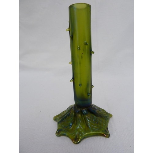 253 - A iridescent green glass solifleur thorn vase, in Loetz style, the cylindrical stem with applied tho... 