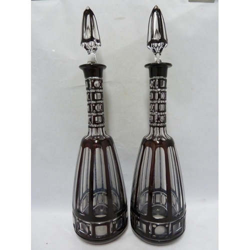 258 - Bohemian - a large pair of mallet form glass decanters of deep ruby overlay cut through to colourles... 