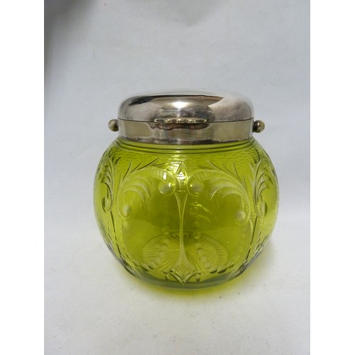 259 - Stevens & Williams - an intaglio cut green on colourless glass biscuit barrel, cut with tassel and p... 