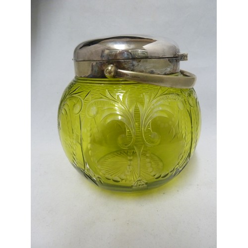 259 - Stevens & Williams - an intaglio cut green on colourless glass biscuit barrel, cut with tassel and p... 