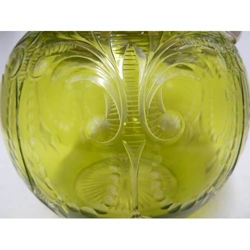 259 - Stevens & Williams - an intaglio cut green on colourless glass biscuit barrel, cut with tassel and p... 