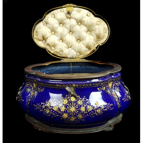 260 - A Limoges enamelled metal casket and cover of quatrefoil bombe form, the deep cobalt blue ground dec... 