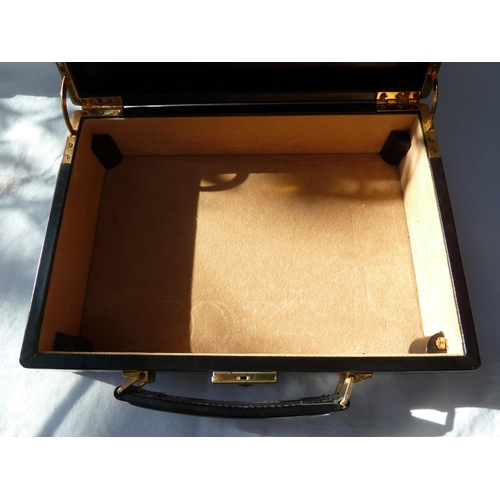 51 - An Asprey black leather jewel case, with key, 25.5cm max (2)