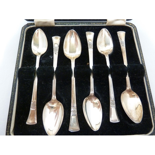 13 - A cased set of silver teaspoons, with flared terminal above a scrolled capitol motif, Sheffield 1963... 