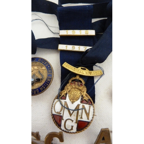 125 - A Queen Mary's Needlework Guild medical branch officers badge on original blue silk suspension ribbo... 