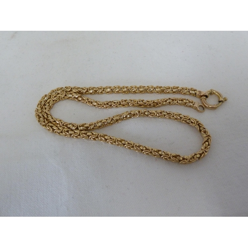 18 - A hallmarked 9ct yellow gold necklace, complex fancy rope link, 52cm, 20grms