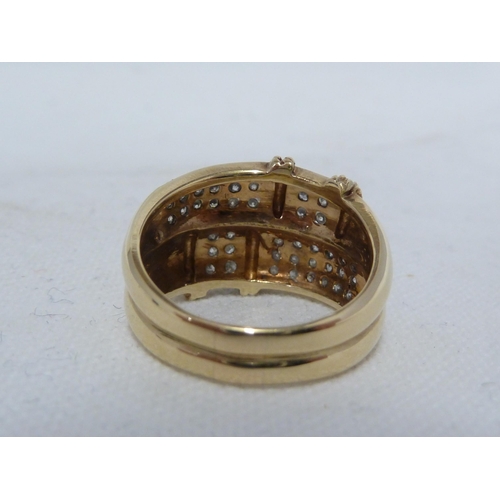 30 - A diamond set dress ring, the rows of circular stones interspersed with two rows of yellow metal bea... 