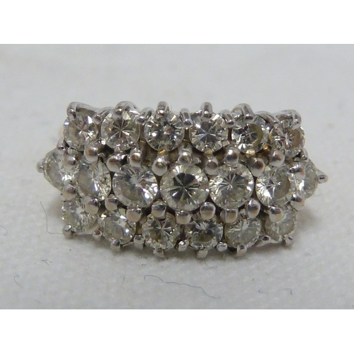 37 - A diamond cluster ring, the round brilliant cut stones arranged in three rows on a hallmarked 18ct y... 