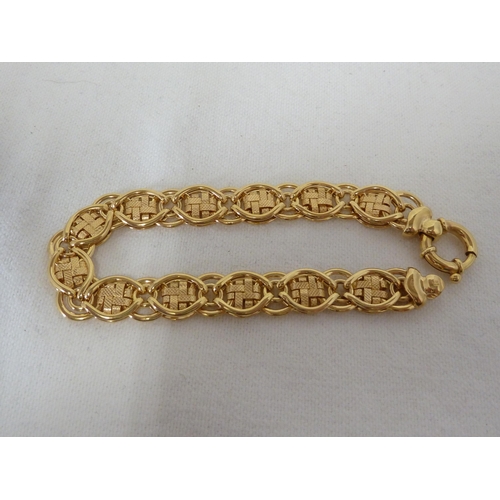 45 - A hallmarked 9ct yellow gold fancy flat link bracelet, 21cm long, 14.1 grms